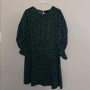 Green dress with black polka dots